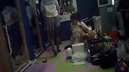 Japanese teen is rubbing her nice tits and wet pussy, while sitting on the floor