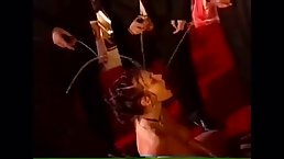 Naked slut is kneeling on the floor, while horny guys are pissing all over her body
