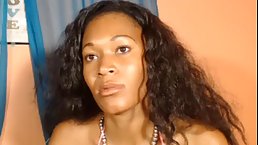 Black woman in pink bra is rubbing her hairy pussy in front of the web camera