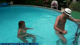 Horny brunette is drooling on her boyfriend’s fat, massive cock, while next to the pool