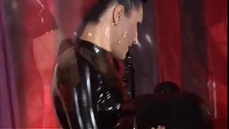 Hot woman in latex outfit and her lover are about to have a great time together