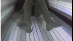 Naive lady did not know about a hidden camera in the tanning room, so she took off her bra
