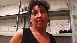 Big titted, mature woman is sucking dick in the storage room, because she is a slut