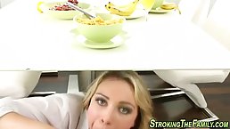 Blonde is sucking a rock hard dick from under the desk and enjoying it a lot