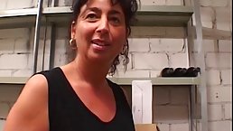 Mature woman with black hair and big tits is having sex with her husband's friend