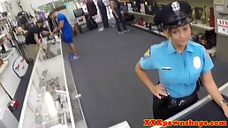 Super hot police lady is about to suck a rock hard meat stick while kneeling on the floor