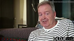 Dark haired, big titted woman is sucking her elderly neighbor's dick to earn some cash