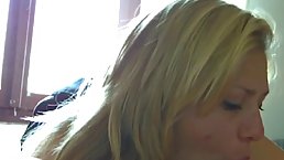 Fat blonde milf is lying on the bed and gently sucking her husband’s hard meat stick