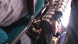 A horny man is putting his fingers in a young Japanese babe’s panties, while in the bus