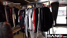 Two horny babes are sucking a huge cock, at the same time, in a dressing room