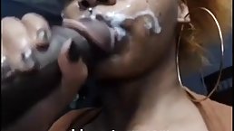 Tattooed black girl sucked a hard cock, while she was in front of the camera