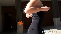 Pretty babe in black sandals with high heels is masturbating in a public place, during the day
