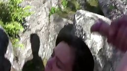 Naughty girl is having sex with three guys at the same time, in the nature