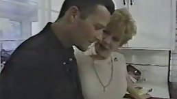 Nasty granny is getting fucked in the kitchen, in the middle of a working day
