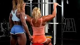 Two muscular females are very horny and having a nice sex affair, while in the gym