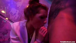 Voluptuous blonde woman is spreading her legs wide for some horny guys, in the night club