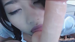 Pigtailed Asian babe is using a sex toy quite often, and masturbating in front of the camera