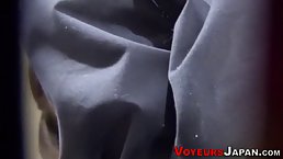 Asian teen in school uniform is masturbating like crazy, in front of a hidden camera