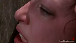 Nasty brunette is having a brutal sex session with a group of horny guys, on the floor
