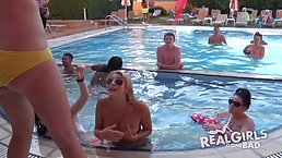 Horny boys and girls are having a lot of fun at the pool party, during the day