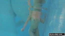 Wealthy blonde is swimming naked in her swimming pool, because her lover likes it like that