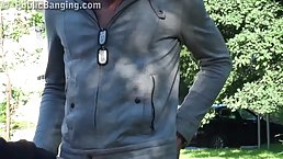 Red haired babe is getting fucked and sucking cock at the same time, in a public place