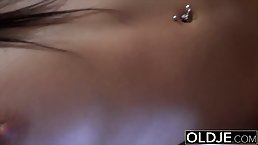 Barely legal brunette is fucking an elderly man, because she likes his rock hard cock