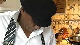 Black man is getting a blowjob from a classy blonde milf, and enjoying it a lot