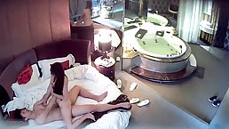 Horny couple is fucking in a hotel room, not knowing about a hidden camera there