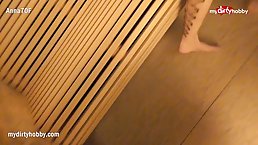 Busty tattooed woman is sucking cock in the sauna, while her partner is moaning from pleasure