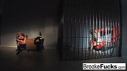 Brooke Banner is masturbating while a lovely girl from her prison cell is staring at her