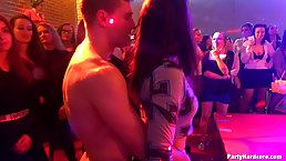 Kinky party girls are getting hammered in a techno club by drunk boys and strippers