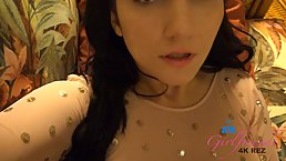 Naughty brunette is giving a great footjob to her horny client, in front of the camera