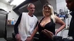 Curvaceous blonde woman is holding her legs spread wide, while her young lover is drilling her slit