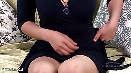 Asian brunette took off her panties and started fingering her hairy pussy, on the sofa