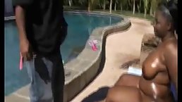 Big ass, black woman is getting banged from the back after sucking a huge, black dick