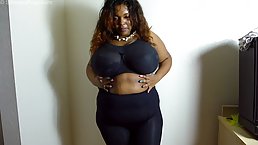 Black woman with massive tits, Gina is about to take off her bra for us