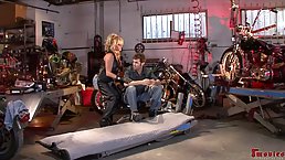 Experienced blonde cougar is having sex in a garage, with a handsome mechanic she has met there