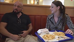 Slutty chick in animal printed jacket was giving pleasure to a stranger, in a burger shop