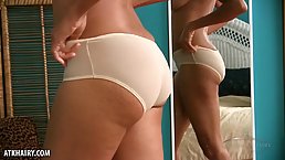 Mature, black woman with small tits, Ariela is about to show us her hairy pussy