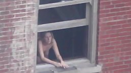 Lusty woman has a thing for getting fucked at the window, in the middle of the day