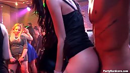 Slutty women are having a great time with handsome guys, in a local night club