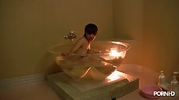 Japanese babe is giving a blowjob to her roommate from a martini glass shaped bath tub