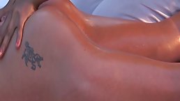 Oiled babes are getting a massage together and moaning, because it makes their pussies wet
