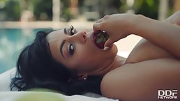 Smashing brunette was caught on tape while she was masturbating next to the swimming pool