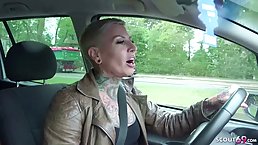 Tattooed German mature with short, blonde hair, Cat Cox is getting a dick up her ass