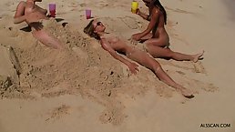 Dirty naked blonde girl is cuddling her bad bestie’s gentle pussy, while on the beach