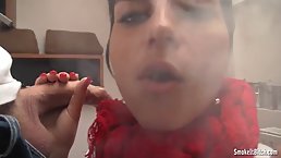 Brunette is smoking a cigarette and sucking her neighbor's dick, while kneeling on the floor