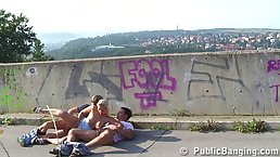 Incredible blonde woman is having a threesome in a public place, with two horny strangers