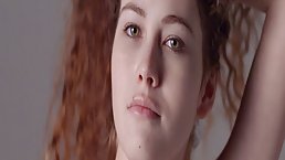 Red haired babe took off her clothes in front of the camera and started dancing